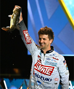 Chad Pipkens with a nice bass on stage at the 2022 Bassmaster Classic.
