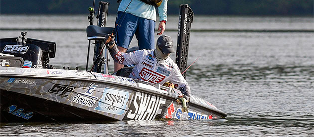 Chad Pipkens boats a Pickwick Lake bass during the 2022 Bassmaster Elite Series tournament.