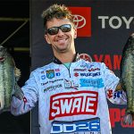 Chad Pipkens with 2 Toledo Bend bass on stage, 2024 Elite Series tournament