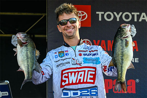 Chad Pipkens with 2 Toledo Bend bass on stage, 2024 Elite Series tournament